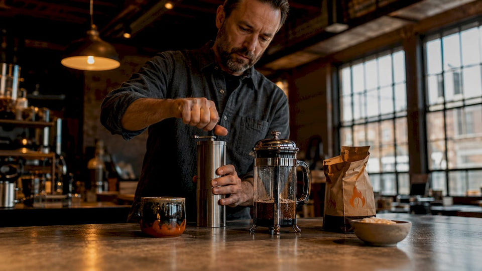 Man brewing bold coffee in home kitchen