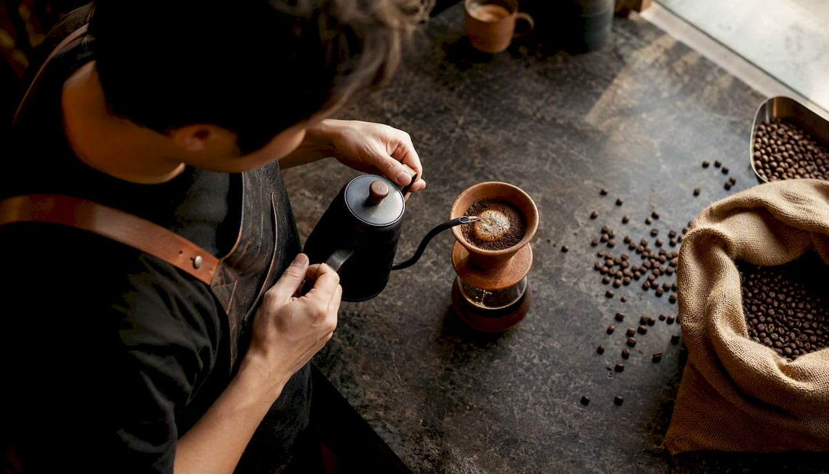 Pouring water over East African coffee grounds
