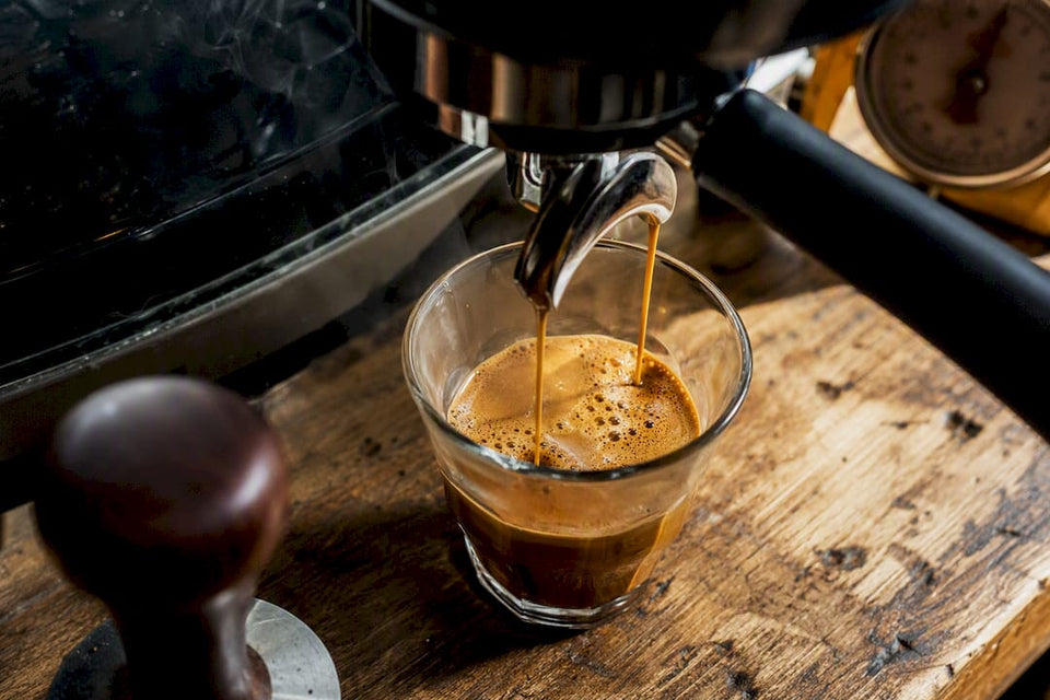 Close-up of espresso crema forming in cup