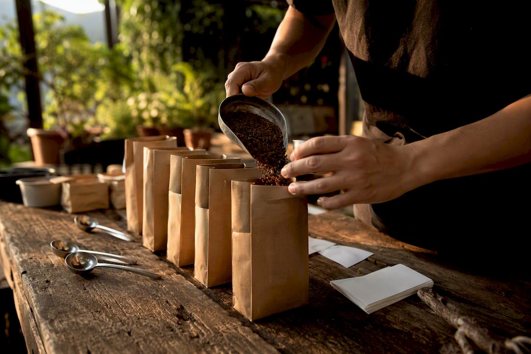 Hands preparing coffee samples for onboarding