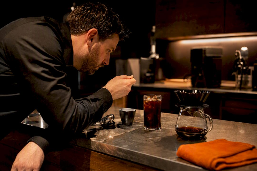 Cafe owner comparing coffee service needs